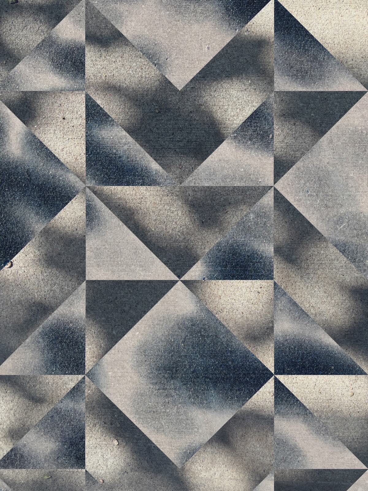 Soft shadows on concrete cut into large triangles that form diamonds and hourglass shapes.